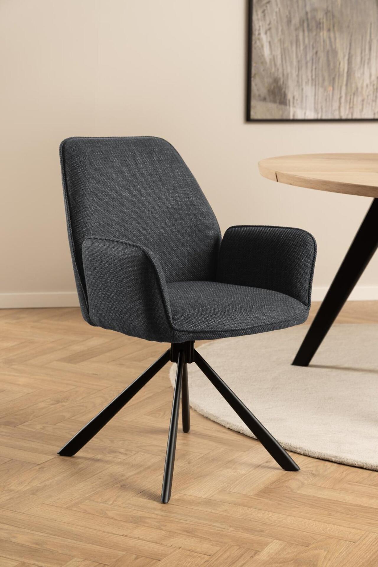 Drehsessel Glenda in Grau mit geschwungenen Formen, gepolsterter Sitzfläche und sternförmigen Metallfüßen für flexible Drehfunktion.