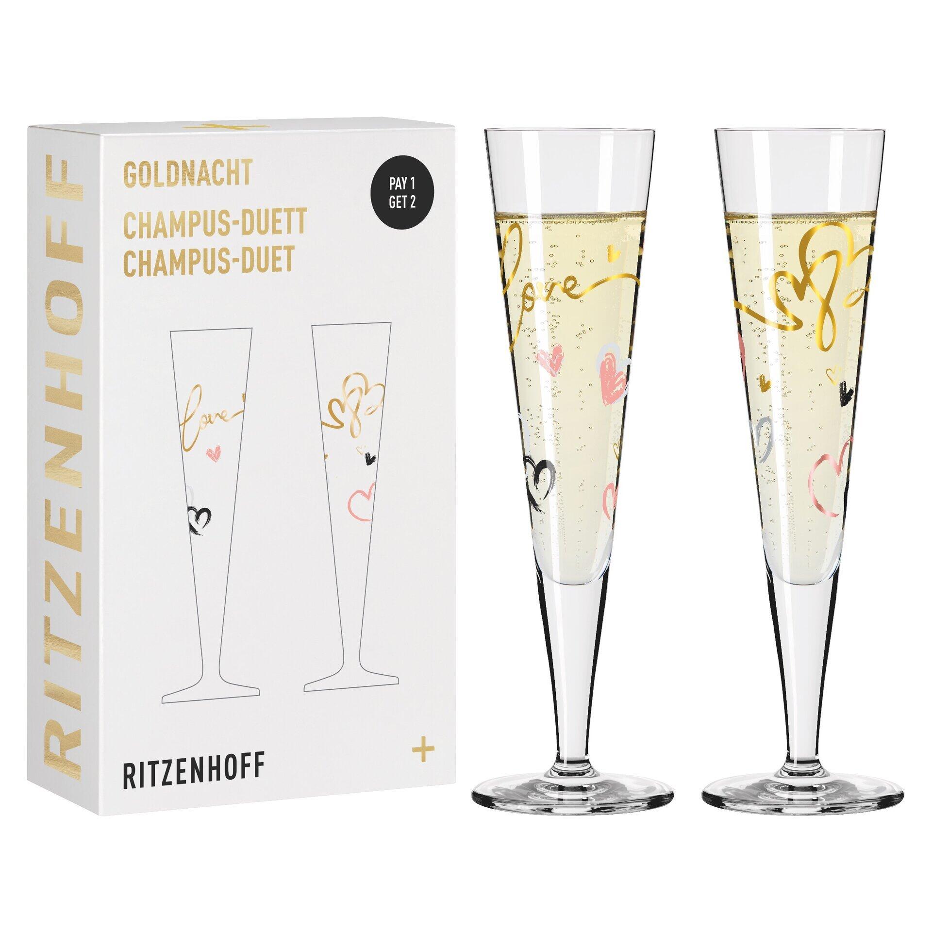 Champagnerglas-Set mit zwei hoch aufragenden Gläsern, verziert mit bunten Herzen und Schriftzügen, präsentiert in einer Geschenkbox mit den Aufschriften "GOLDNACHT", "RITZENHOFF" und "CHAMPUS-DUETT".
