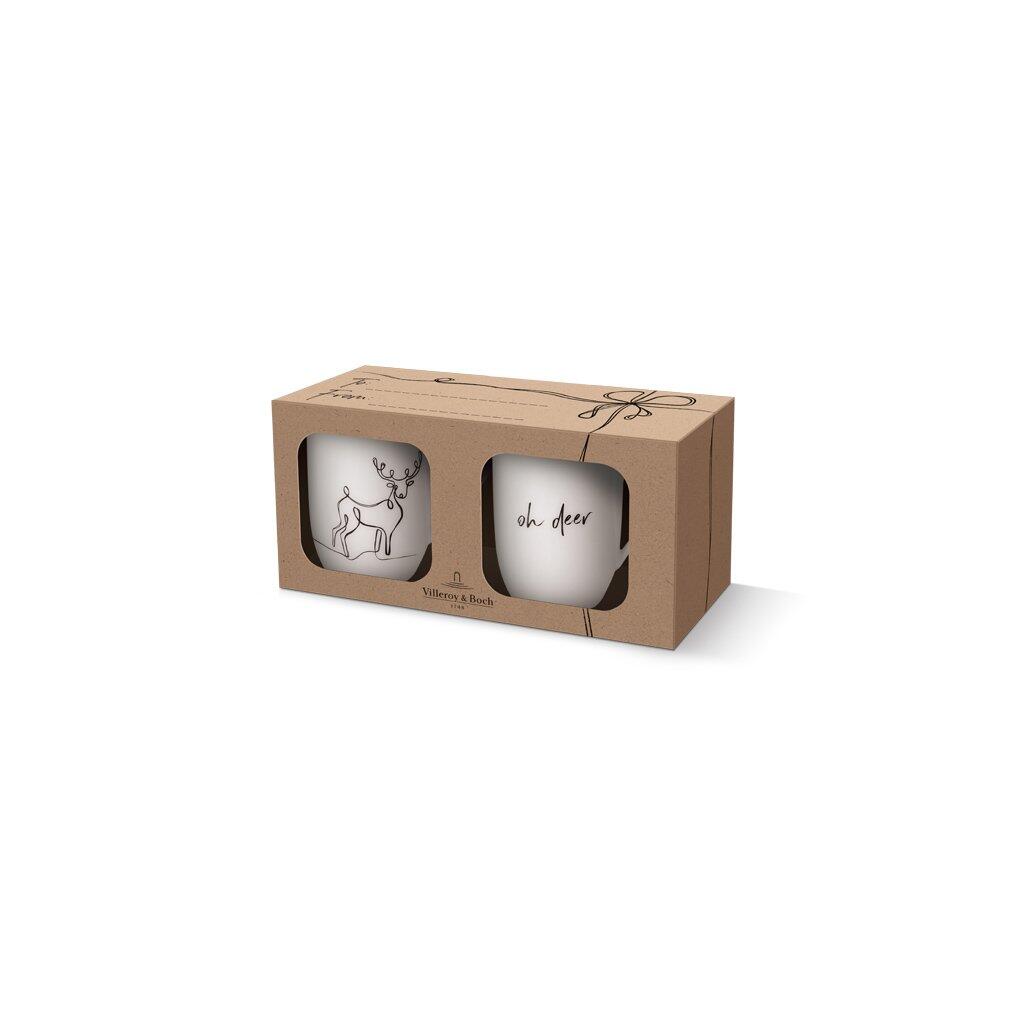 XMAS Set Rentier 2tlg.: Zwei weiße Tassen mit Hirschmotiv und Schriftzug "oh deer" in einer hellgrauen Geschenkverpackung von Villeroy & Boch.