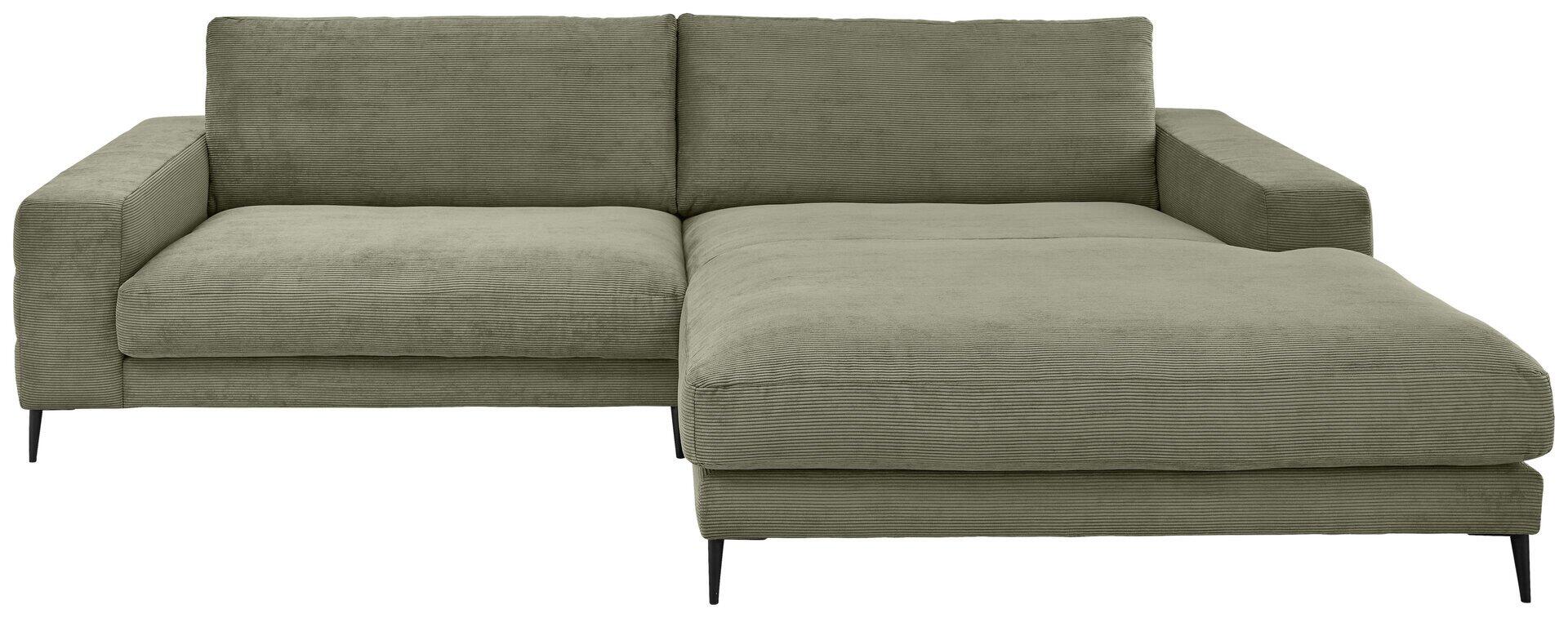 Graungrünes Ecksofa Badia Base 2.0 mit Loungeteil und breiter Sitzfläche, das einen rechten Winkel bildet, auf schlanken, schwarzen Metallfüßen.