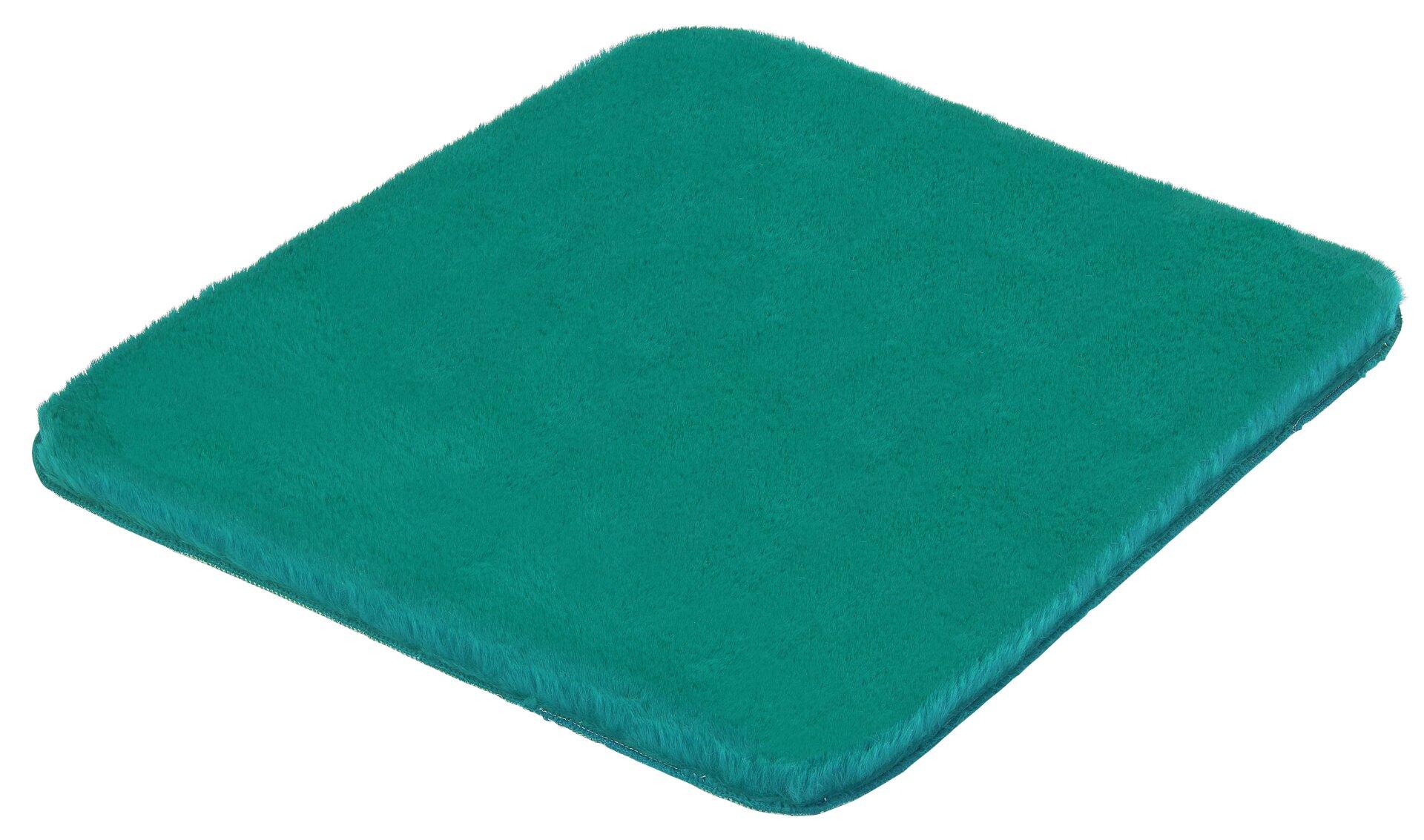 Flauschiger, petrolfarbener Badteppich Cony aus Polyester, dargestellt in einer Dreiperspektive, der als Sitzkissen, Fußteil oder Dekoration genutzt werden kann.