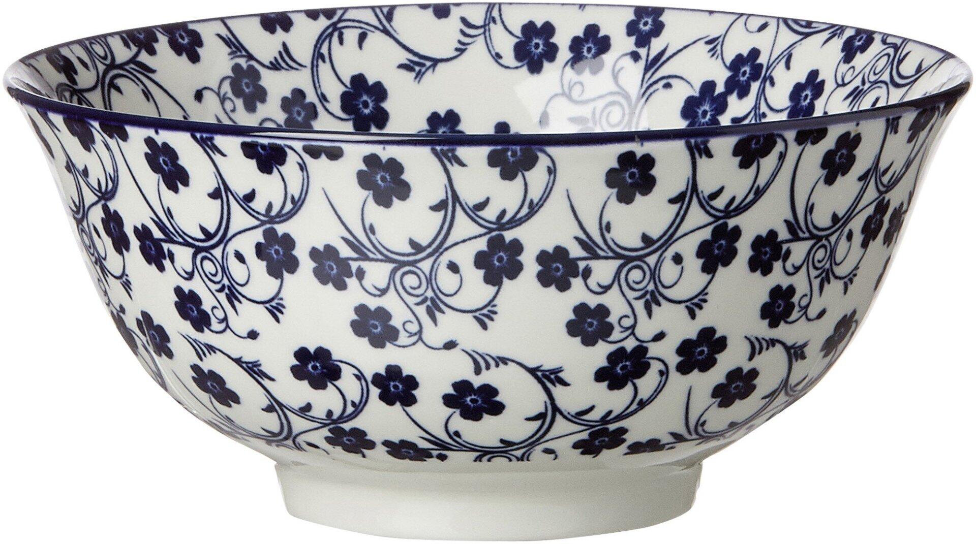 Tiefblaue Müsli-Schale "Sakura" mit filgranem Blütenmuster, konische Form und leicht nach innen gebogenem Rand.
