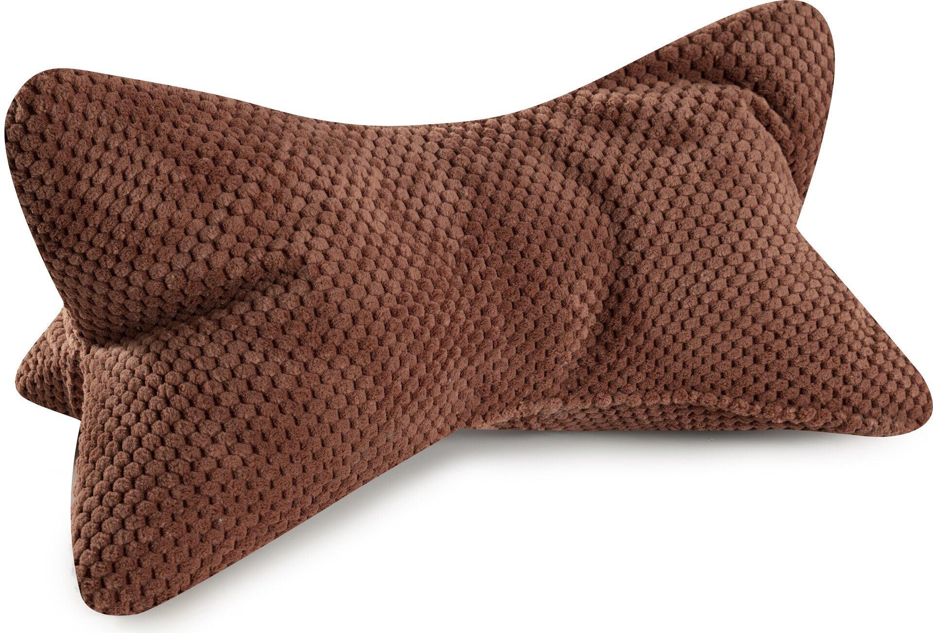 Leseknochen Comodo Nackenkissen in warmem Braun mit ergonomischer Form und weicher, strukturierter Oberfläche für optimalen Nackenhalt.