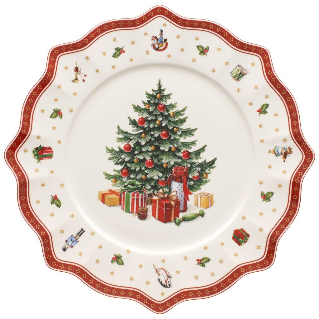 Weihnachts-Platzteller "Toy's Delight" von Villeroy & Boch mit gewelltem Rand und Vogelperspektive, zeigt einen geschmückten Weihnachtsbaum mit Geschenken und Verzierungen.