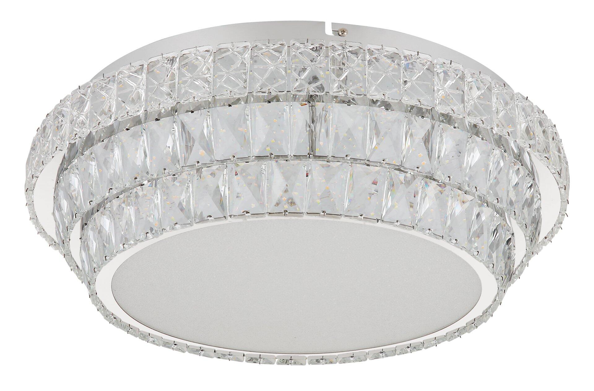 Deckenleuchte KLARA mit glänzendem Silberkörper und dekorativen Kristallringen, die das Licht reflektieren und für einen luxuriösen Effekt sorgen.