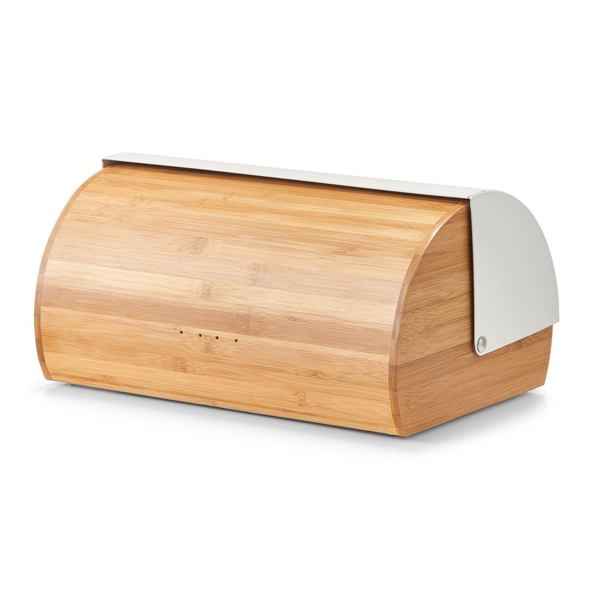 Brotbox im schrägen Seitenblick mit rundlicher Form, silbernem Deckel und hellen Holzlamellen.