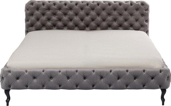 Bett Desire Velvet Silbergrau in Frontalperspektive mit dunkelgrauem Samtbezug, hochgestelltem Kopfteil mit Karomuster und schlanken Füßen aus Massivholz.