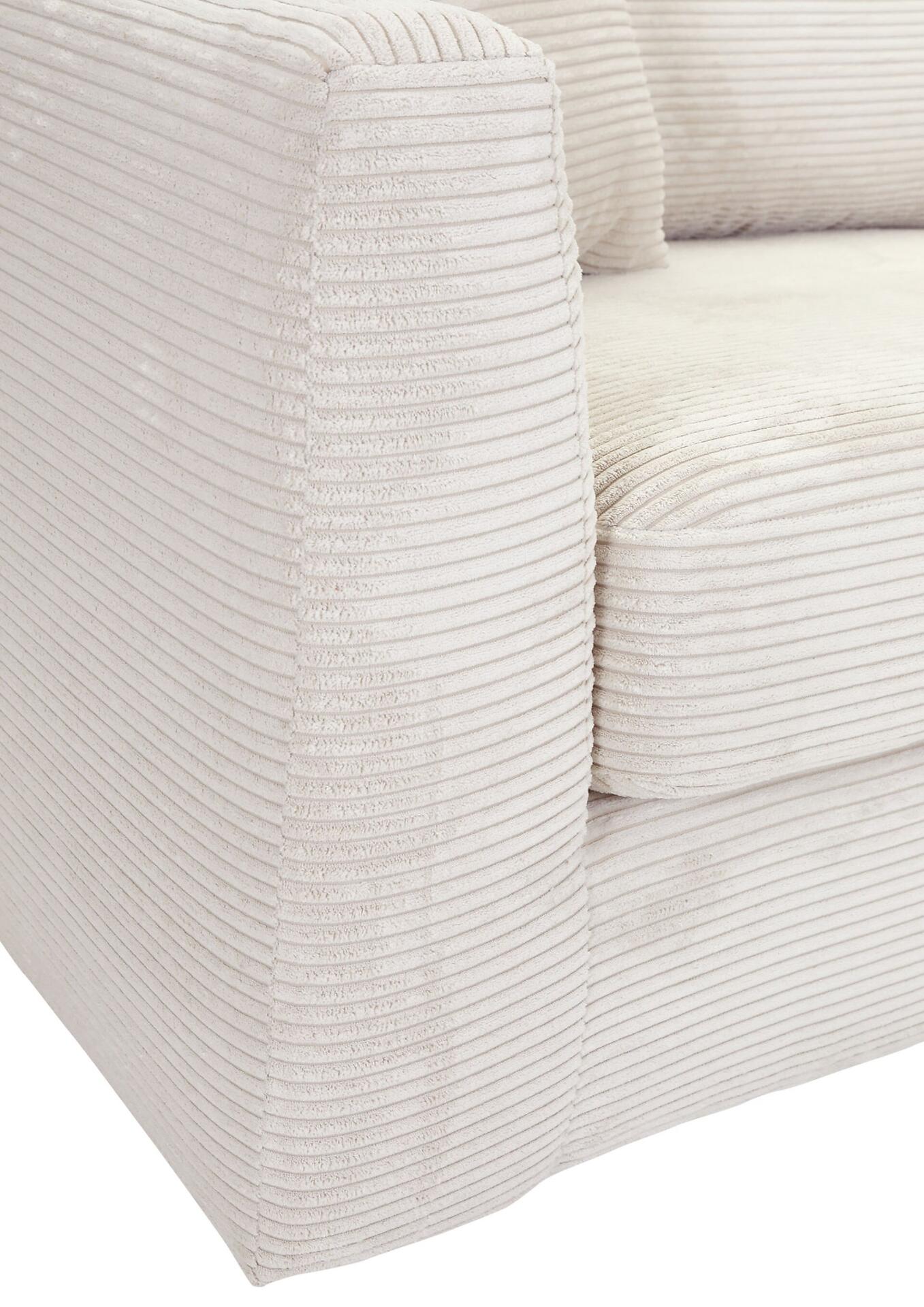 Detailaufnahme des Sofas 4018711017558: Schrägansicht des Armteils mit vertikalen Kordeln, die eine strukturierte Cordoptik zeigen.