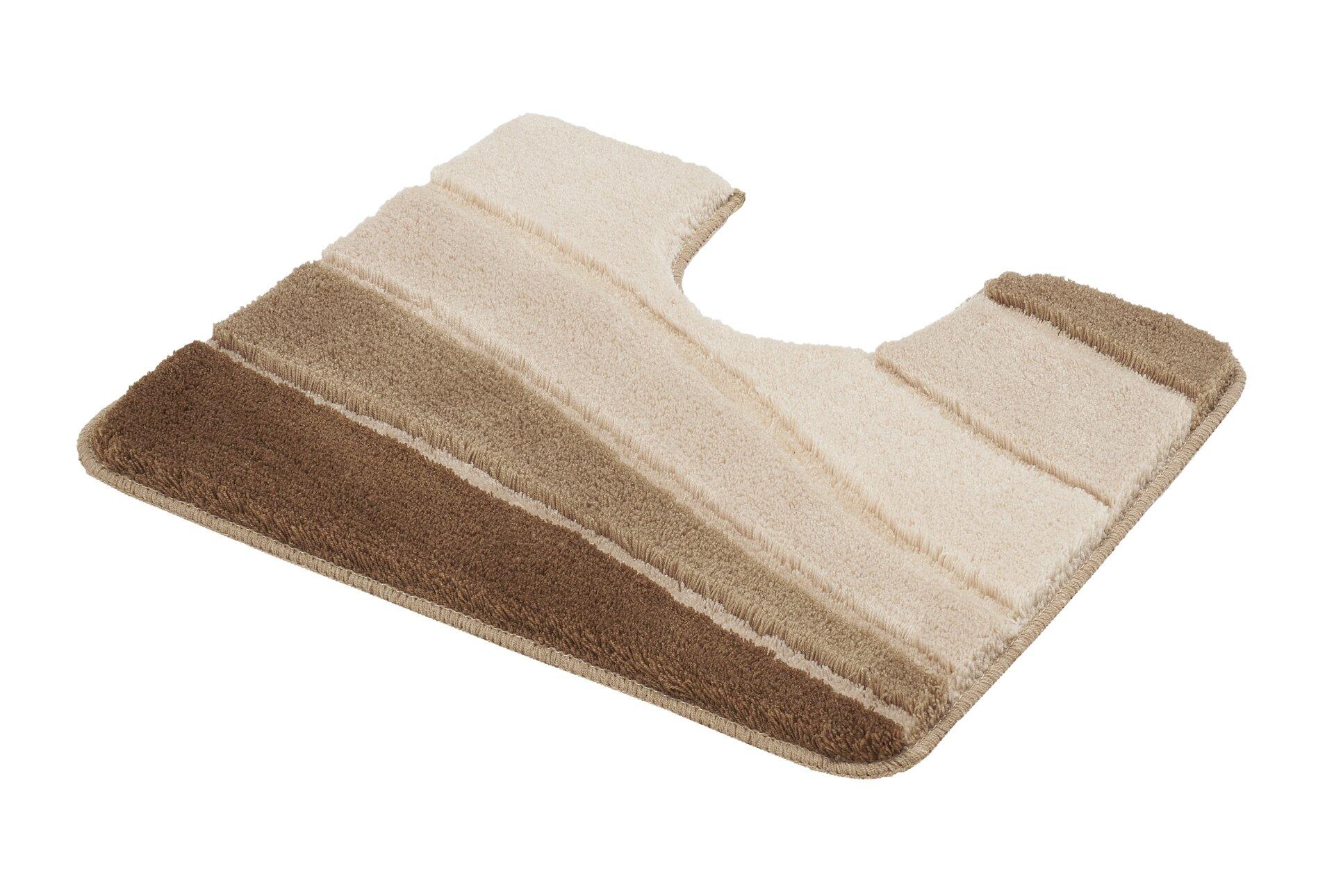 WC-Vorleger Ocean: Asymmetrischer Teppich mit Farbverlauf von Dunkelbraun zu Beige, gezeigt aus schräger Vogelperspektive.
