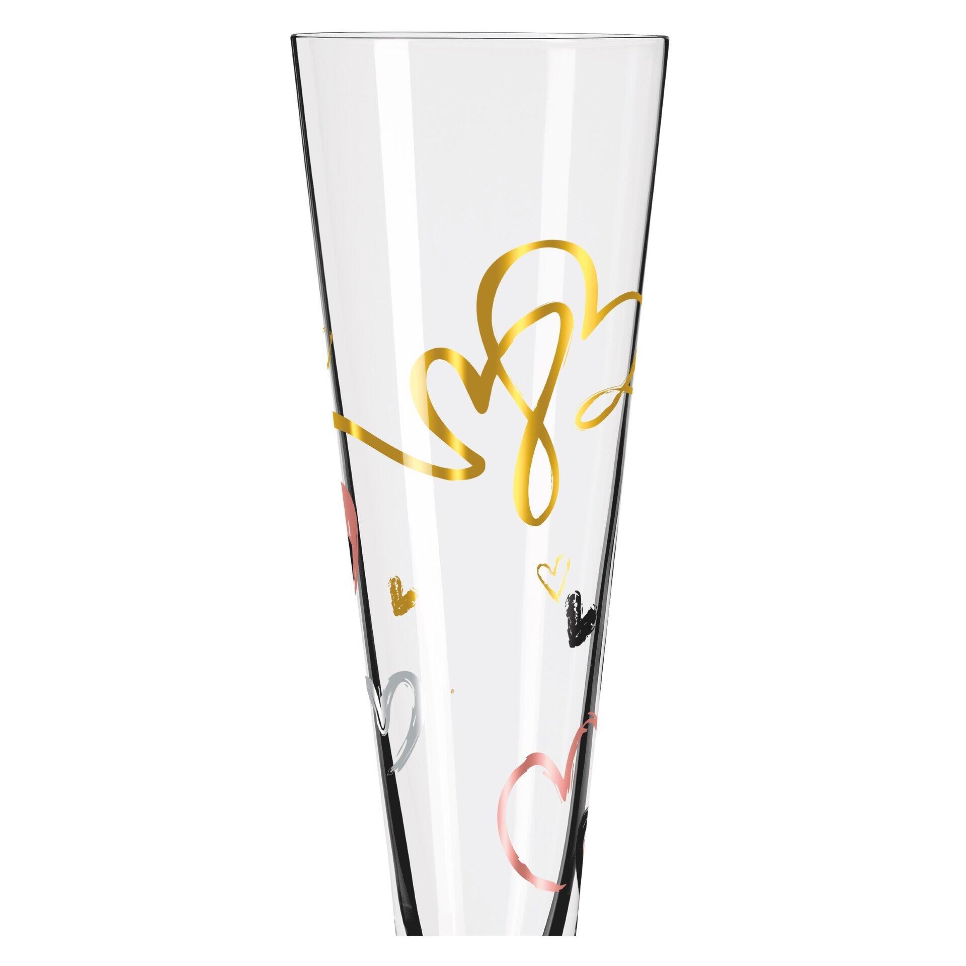Hoher, schlanker Champagnerglas-Vasenaufsatz mit verspielten Gold-, Schwarz- und Rosselementen in Herzform, präsentiert in einer Frontalansicht.