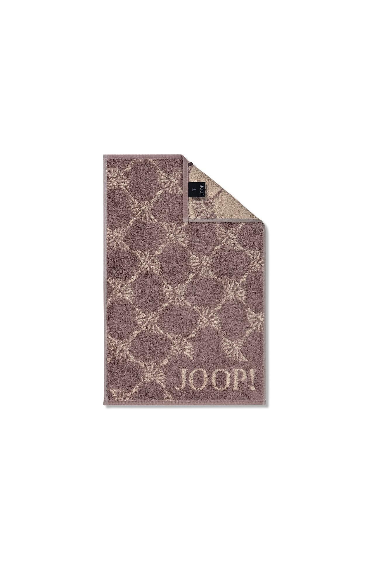 JOOP! Gästetuch Cornflower: Rosefarbener, gemusterten Teppich mit geometrischen Rottönen aus Baumwolle, aus Vogelperspektive erkennbar mit sauber geschnittenen Kanten und JOOP!-Etikett.