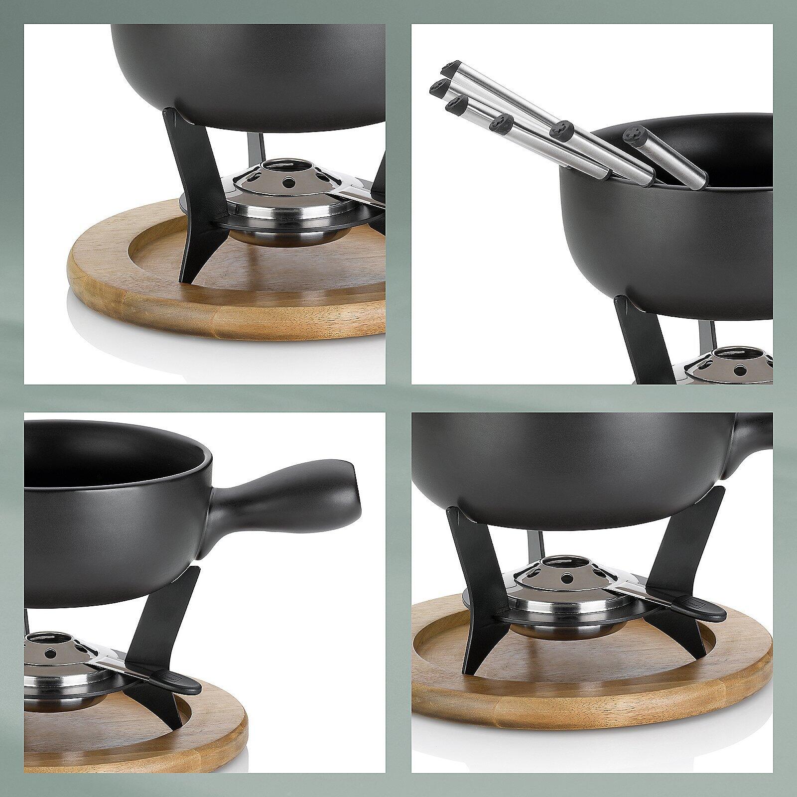 Raclette-Ofen "Country" mit rundem, dunkelgrauem Korpus, silberfarbener Heizplatte und ergonomischem Griff auf einem Holzbrett.